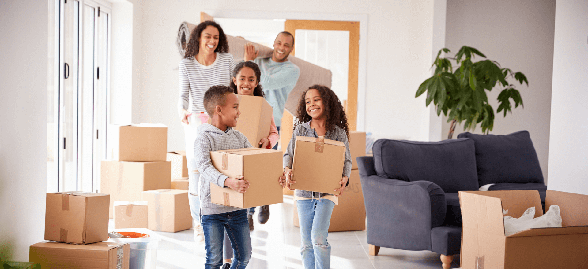 Happy family moving in to their new home thanks to Jhanti Mortgage Broker Corporation